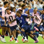 Sidny Lopes Cabral celebrates with teammates after scoring an impossible equaliser to make it 2–2 AET against Argentina.